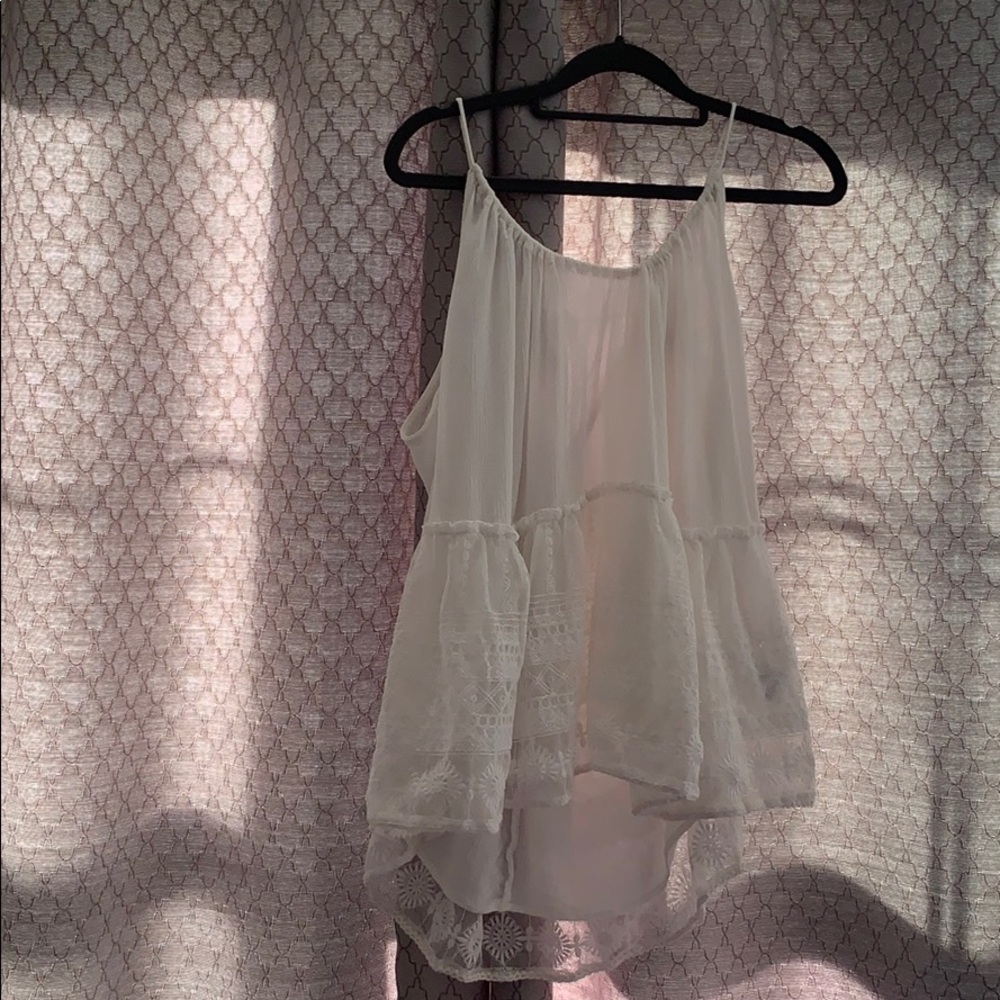 White long shirt with lace design at the bottom